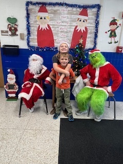 Santa and Grinch pictures at school.