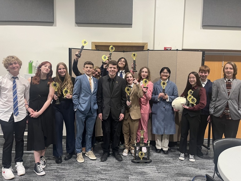 Group of students smiling with awards