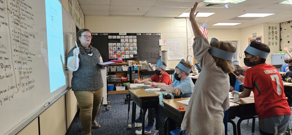 Teacher is asking questions about fractions.