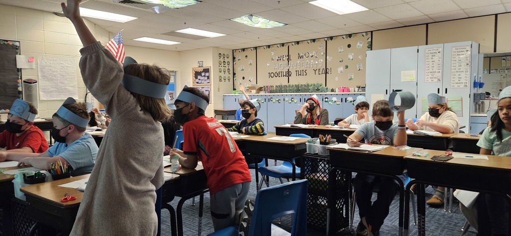Students listen to teacher