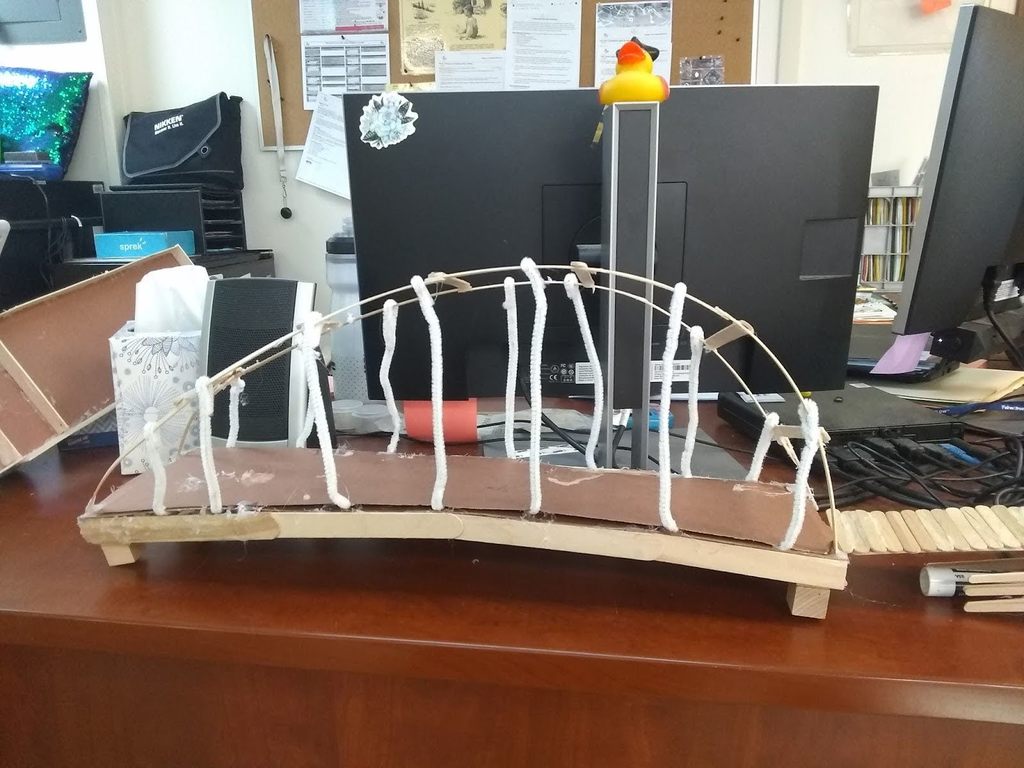 Bridge Acadamy students try out different materials to create bridges.