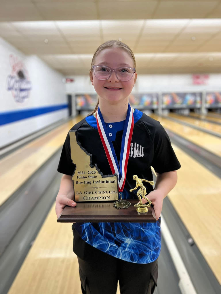 Braylynn Jeroue holding the Girls Singles Champion ship trophie for bowling.