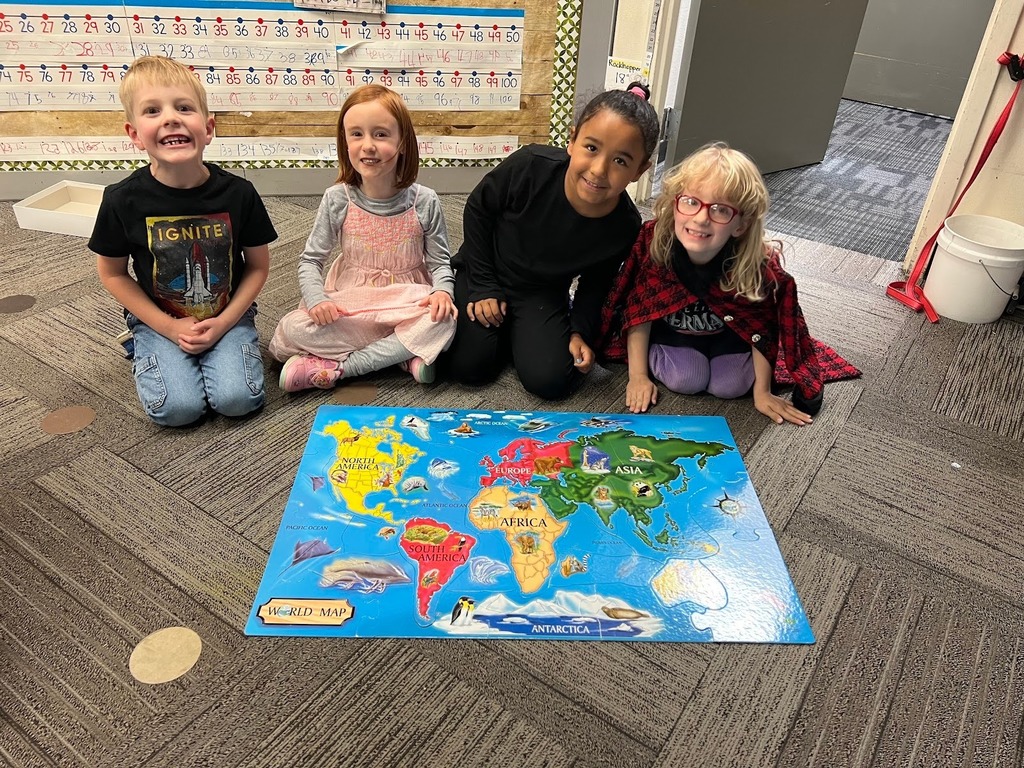 Kids at Lincoln Elementary with a map they made together for "T day".