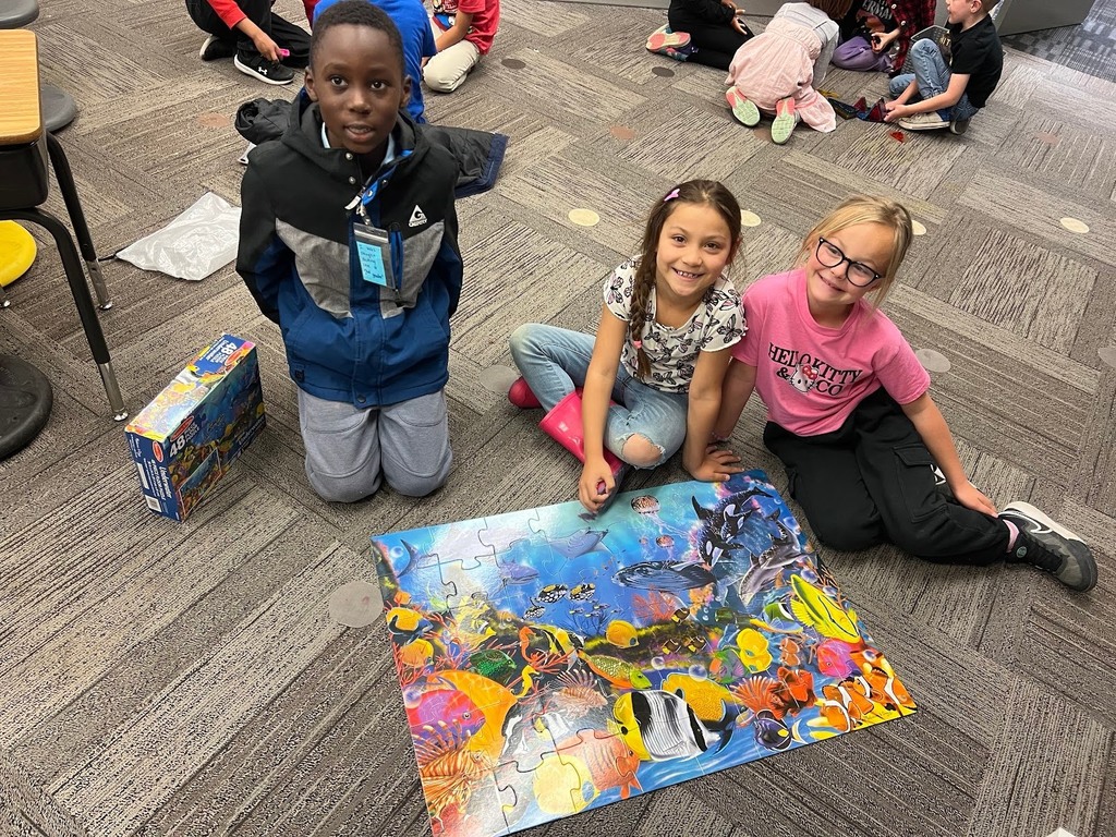 Kids at Lincoln Elementary with a map they made together for "T day".