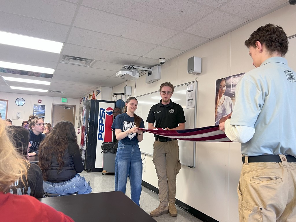 Bridge Academy Raising the flag for the new flagpole on campus