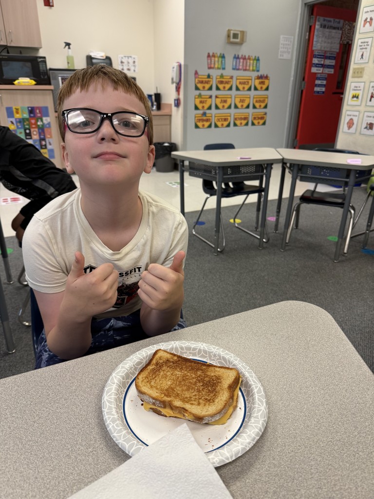Thumbs up from happy student