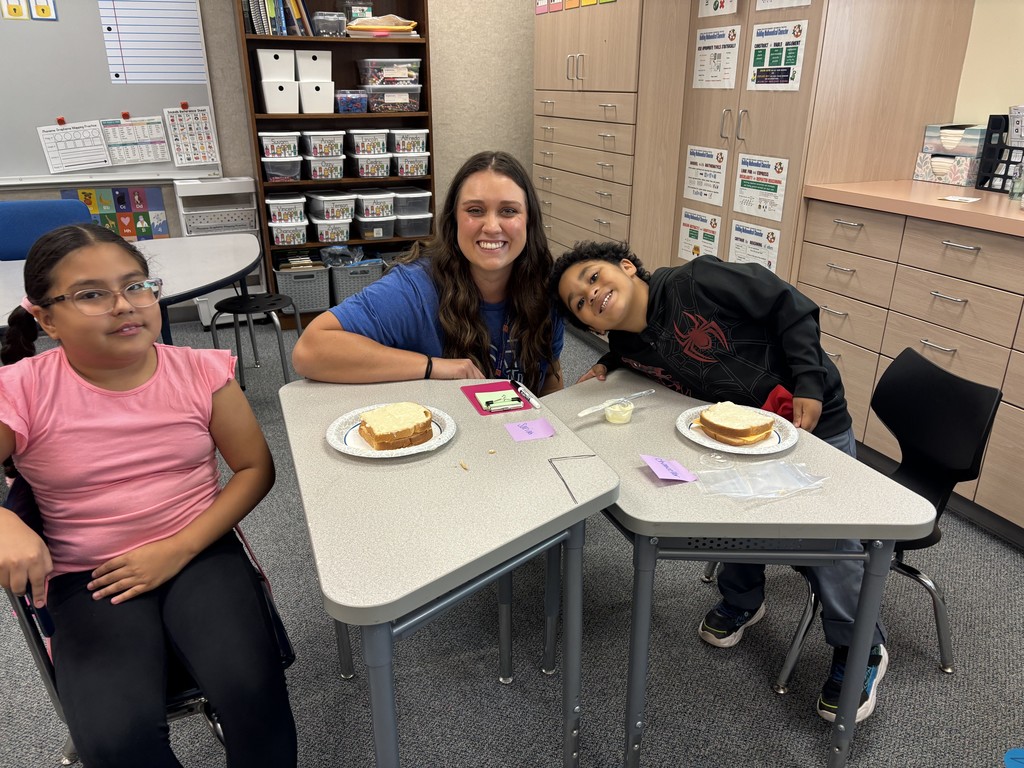 Teacher smiling with students