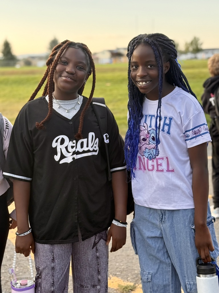 Two students smiling together