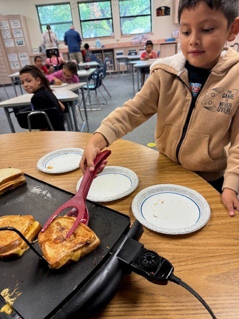 Student Grilling Cheeses