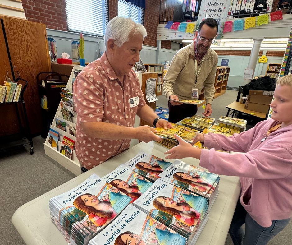 Men passing out books to children