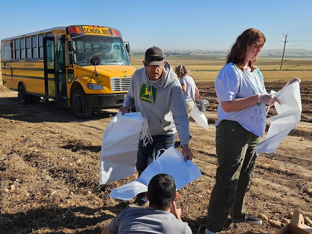 CRHS Nest Students picking bagging their own potatoes