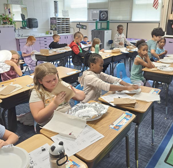 Mr.s Newlin's Wnd grade class making sun protection hats.