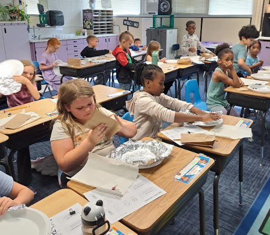 Students making hats