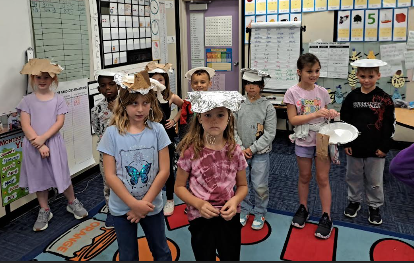 Students wearing homemade hats