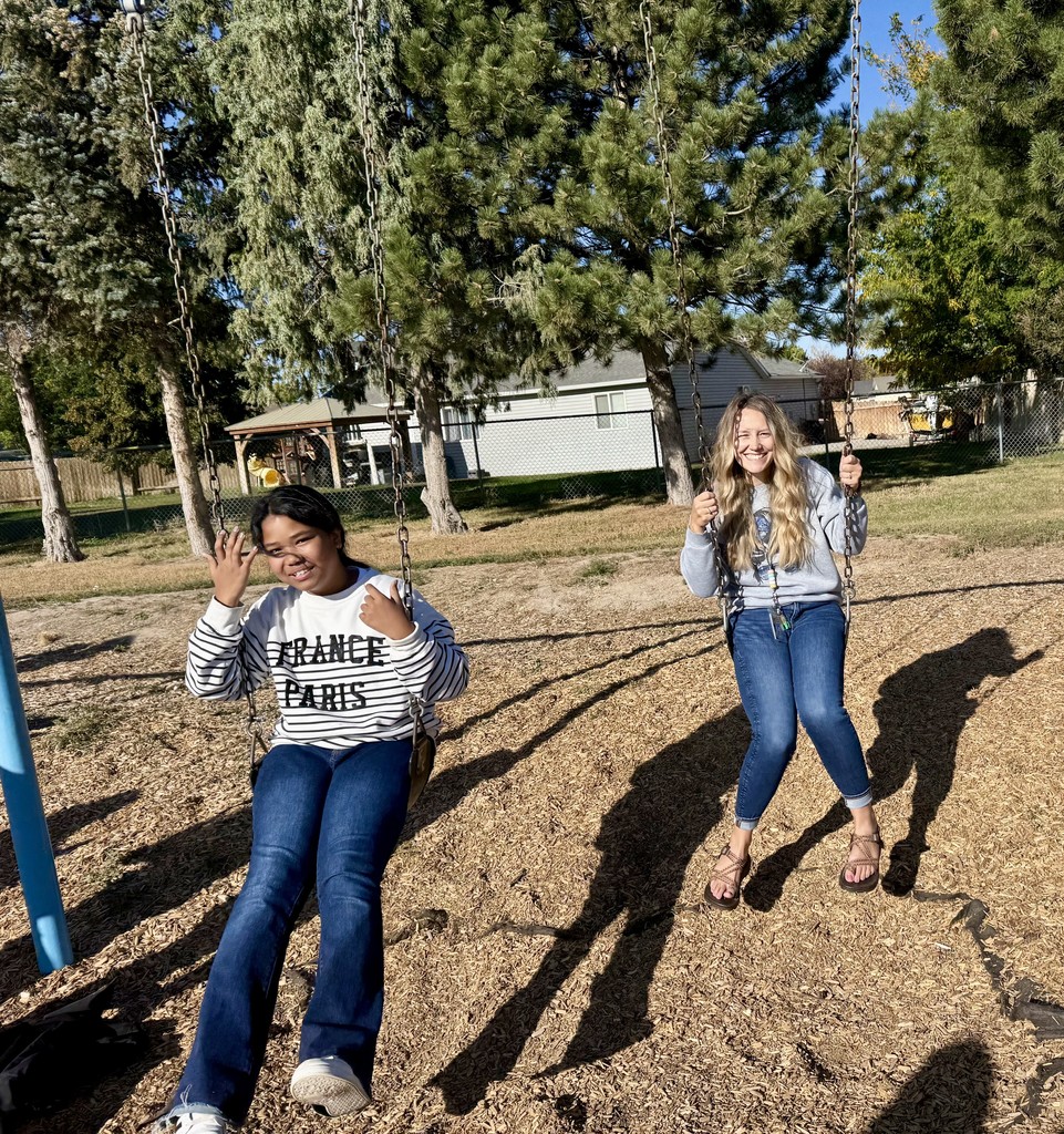 Recess Fun - student and teacher swinging