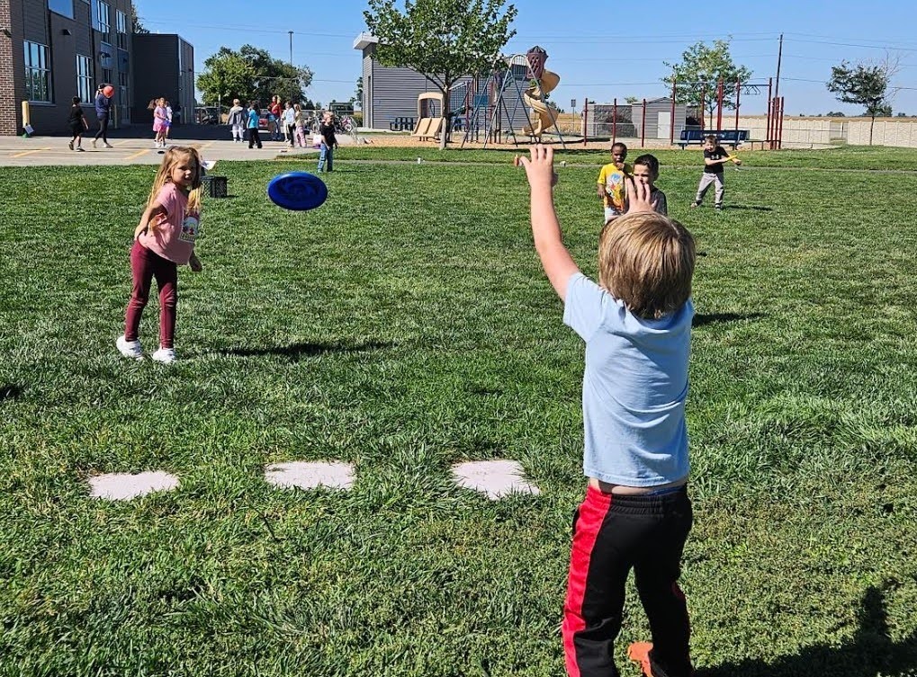 Rock Creek children playing frisbee.