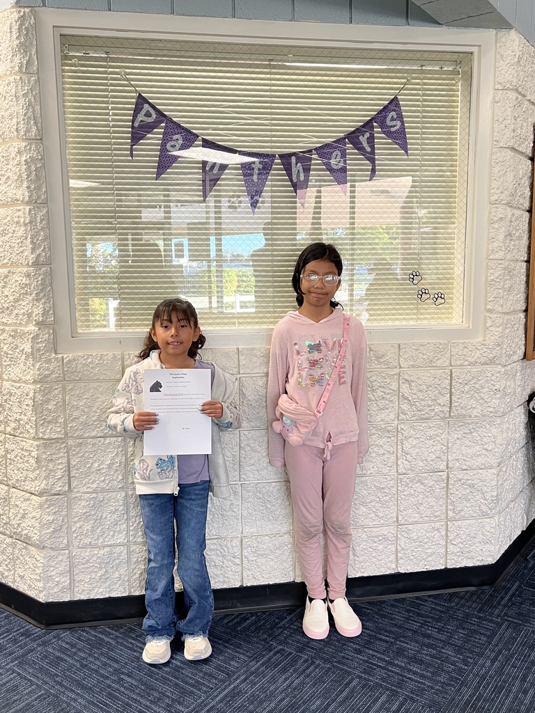 Student with Principal's Pride Award