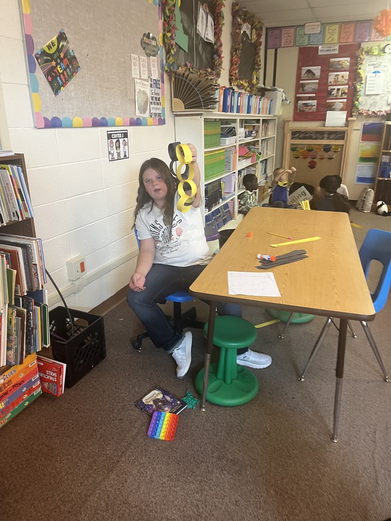 Student shows the row she made.