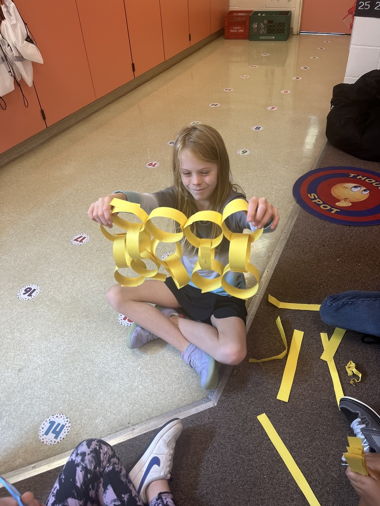 Student shows an array she made.