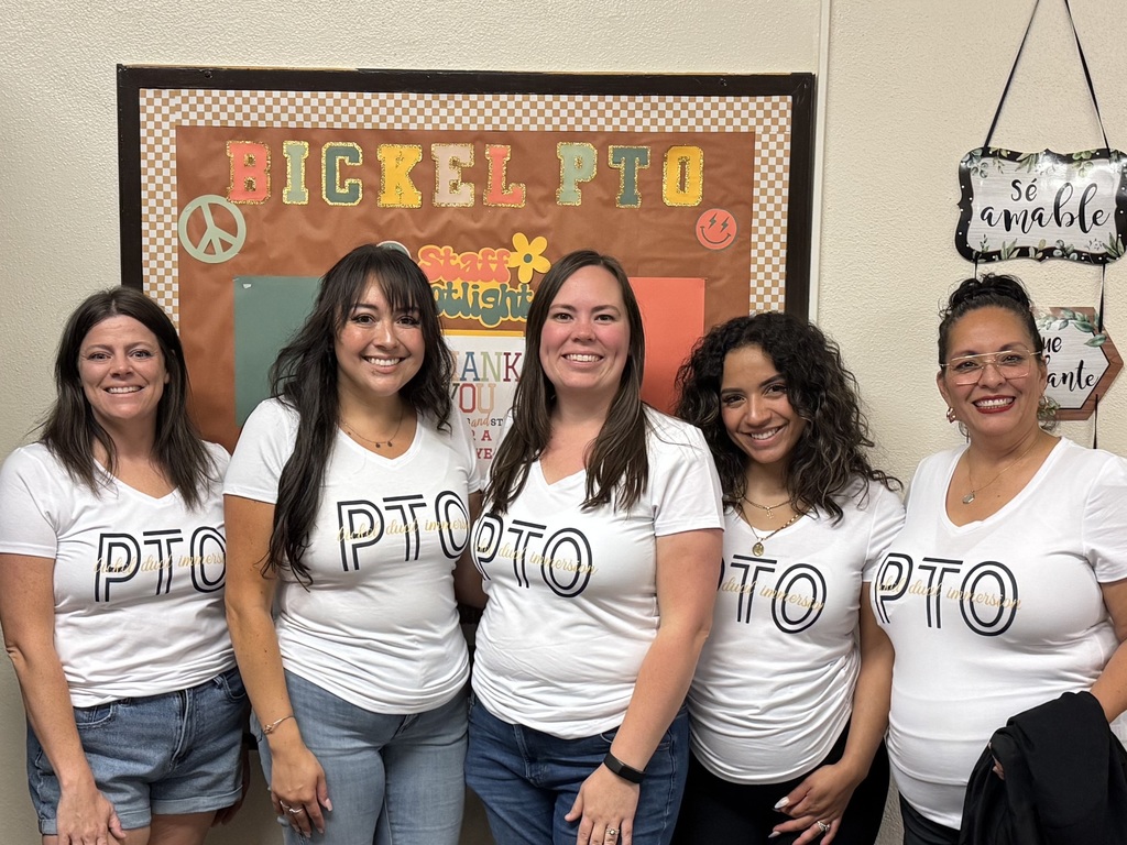 5 women standing together in matching  PTO shirts