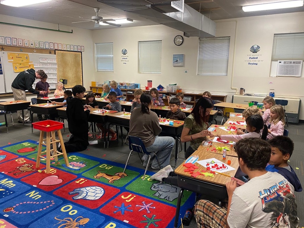 Bridge Academy students working along side Morningside 1st graders and creating apples.