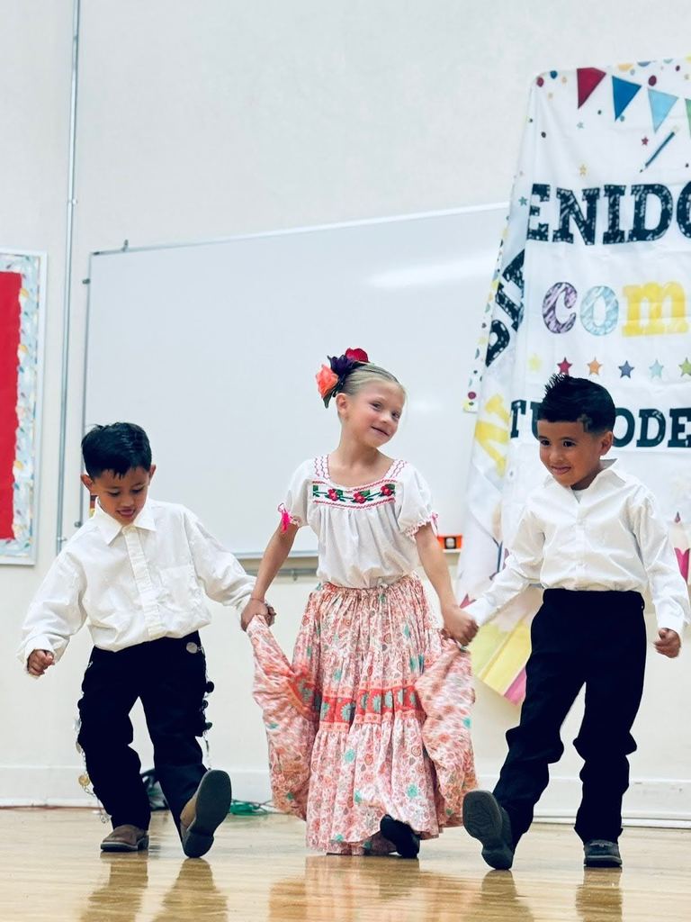 Students performing traditional Mexican and Columbian dances.