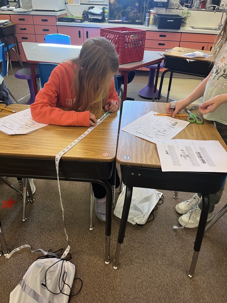 Student using a measuring tape.