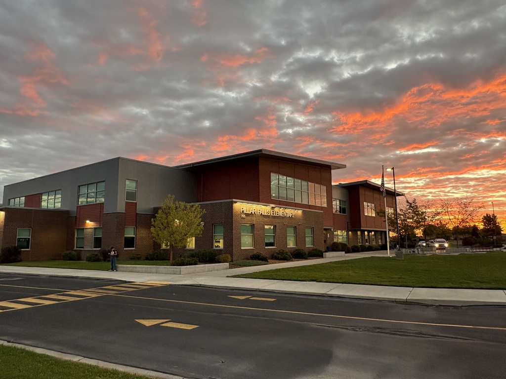 school with sunrise in the background