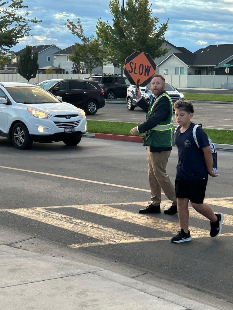 Dr. Nesmith helping Rock Creek by covering for the crossing guard.