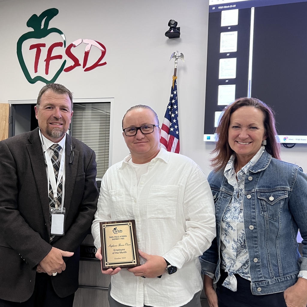 Stephanie Olsen October Employee of the Month with her Employee of the Month Plaque.