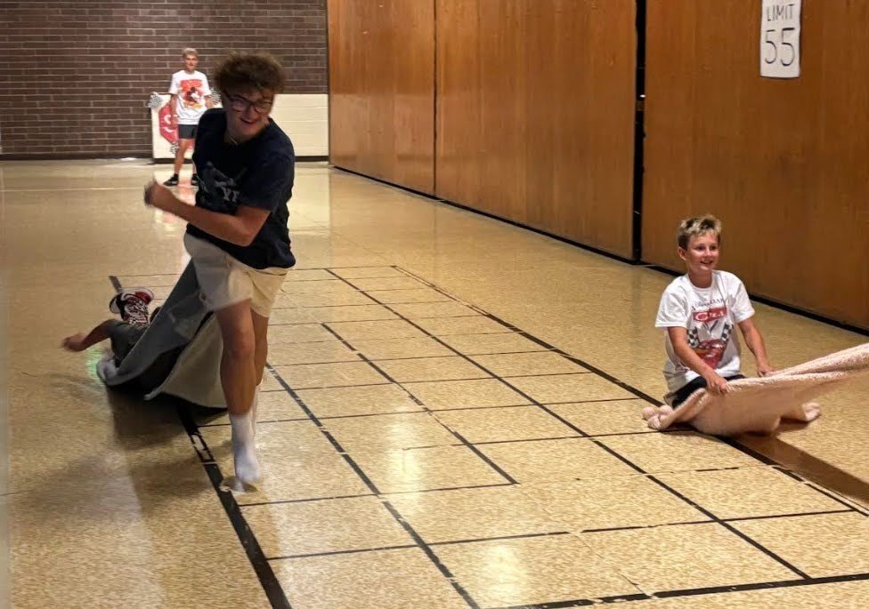 O'Leary students doing a relay race in the hall.