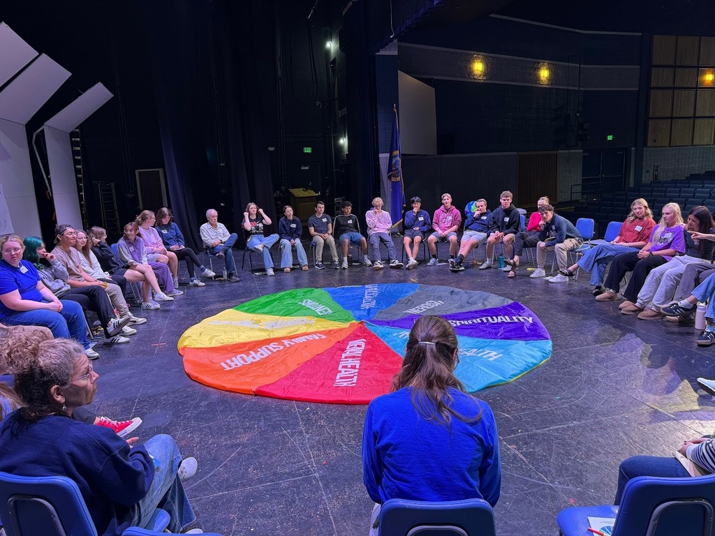 The Source of strength program at Twn Falls High School students sitting in a circle .