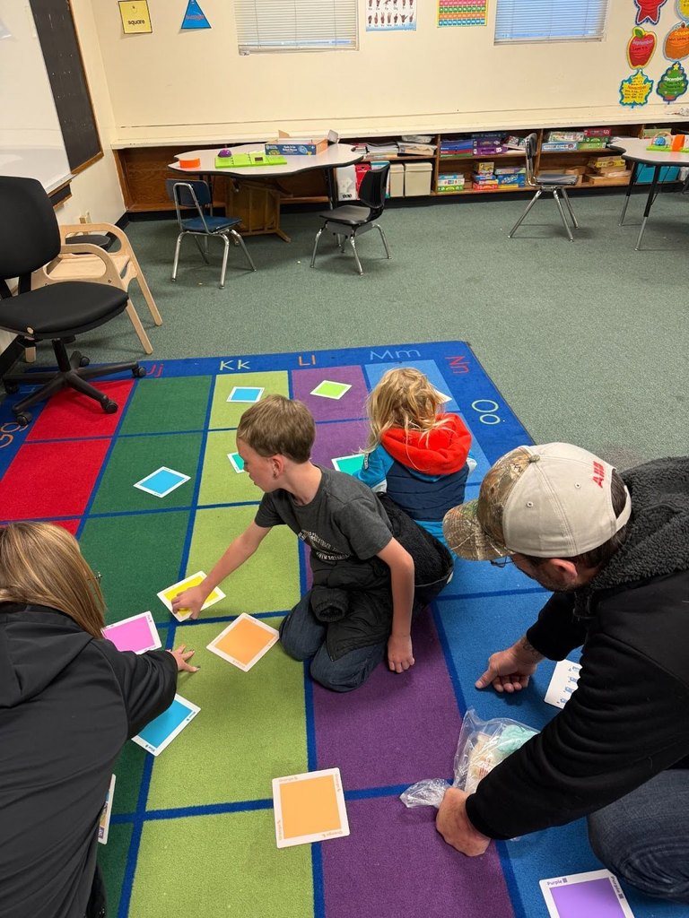 Students and parents at Harrison Elementary working together at STEM night.