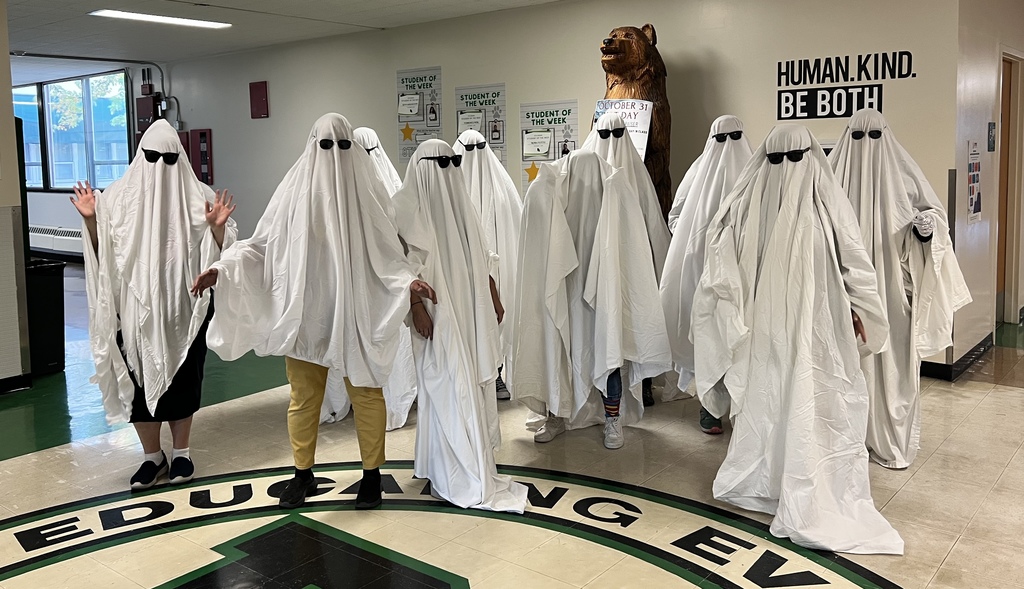 a group of people dressed as ghosts