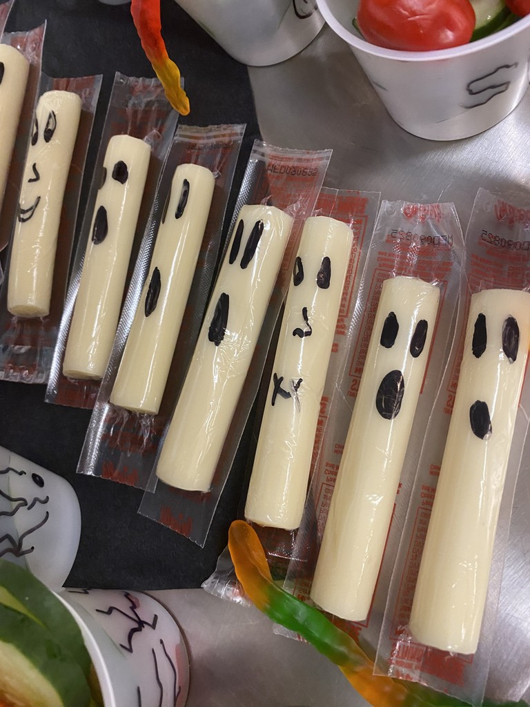 Cheese sticks with ghost faces