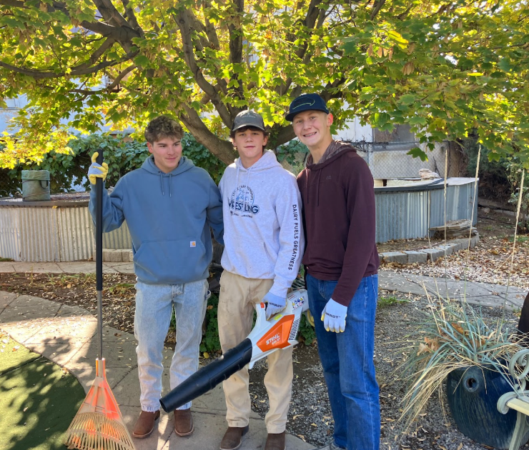 Students with yard tools.