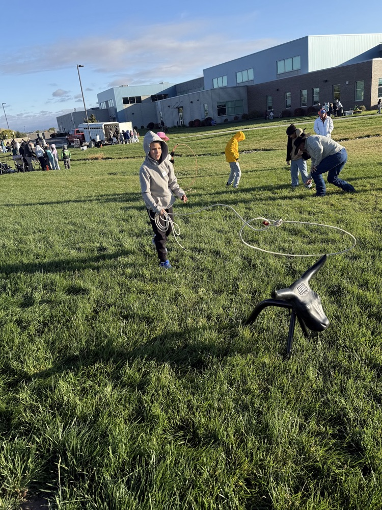 Students learning how to use a lasso