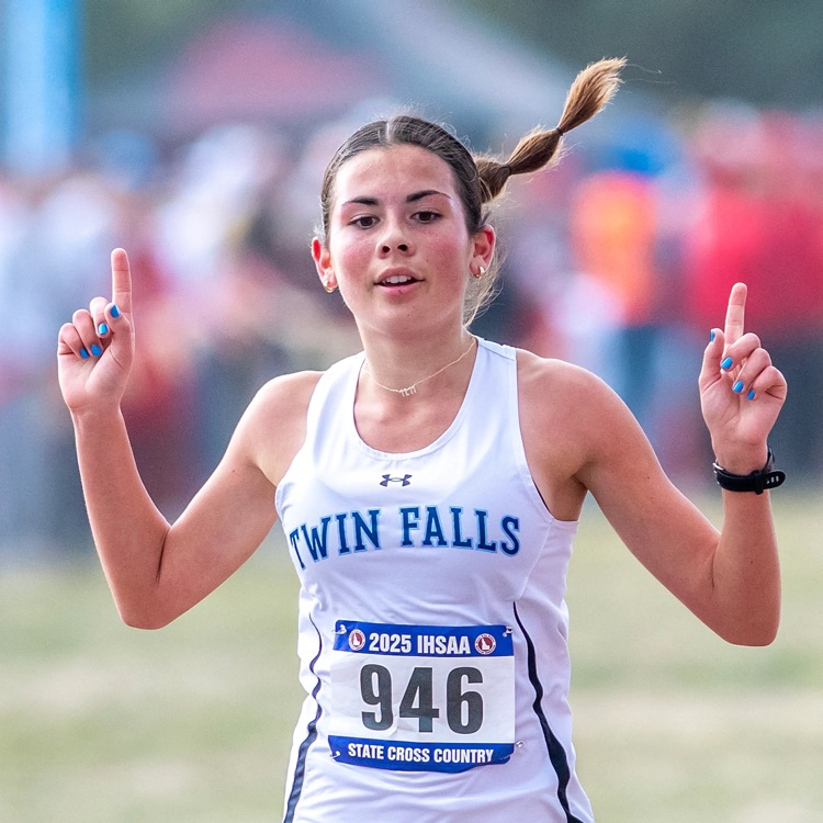 Girl Running across finish line with #1 fingers