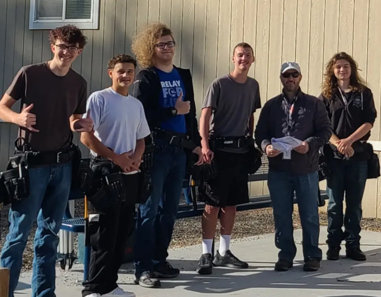 Construction students pose for a picture.