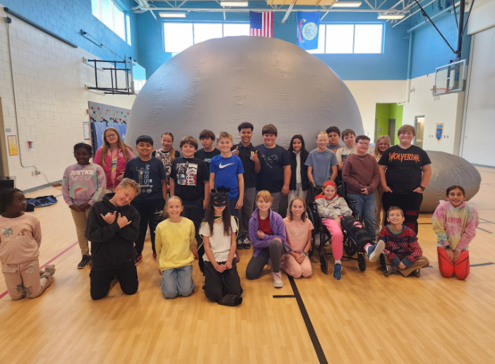 Students pose with the inflatable planetarium.