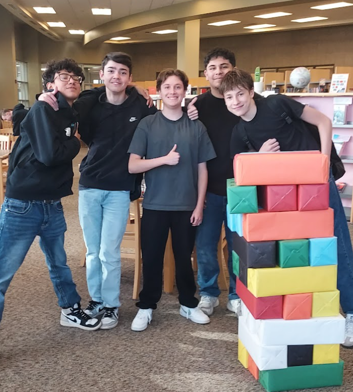 Students celebrate world kindness day in the CRHS library playing mega jenga