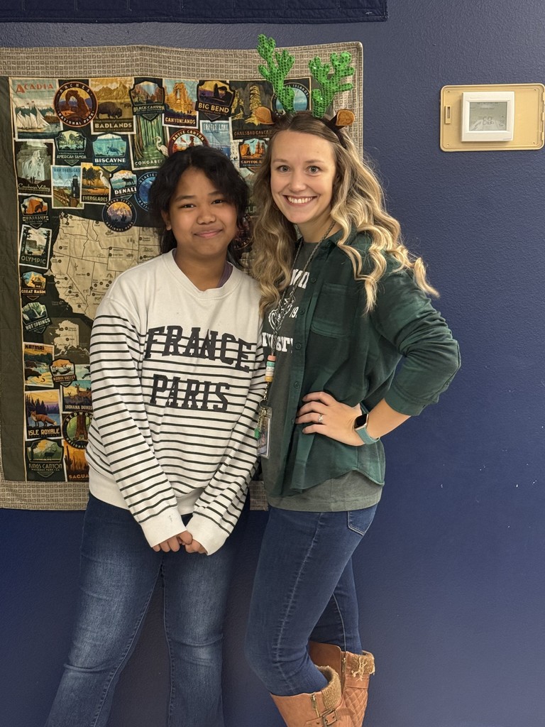 Teacher Photographer and student photographer smiling for a picture