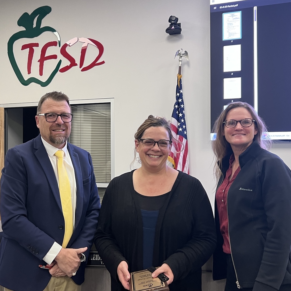 Picture of Employee of the Month with superintendent and board member.