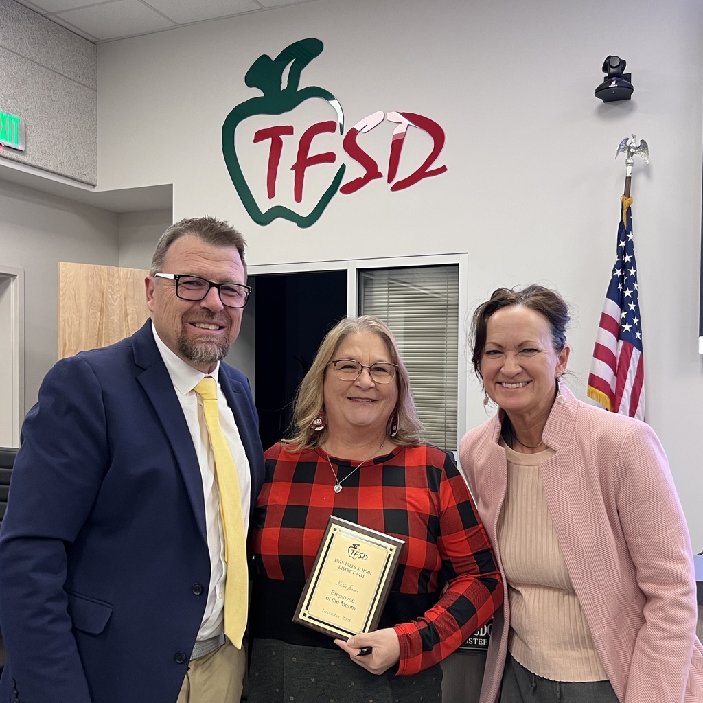 Employee of the Month pictured with superintendent and board member