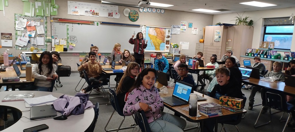 Students and teacher smiling