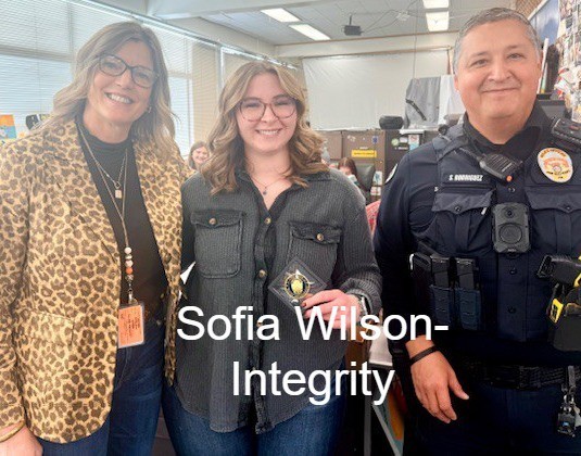 SRO,  Female Student, and Principal standing with Challenge Coin