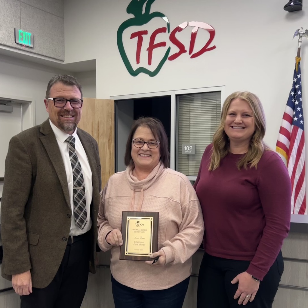 Employee of the Month pictured with superintendent and board member