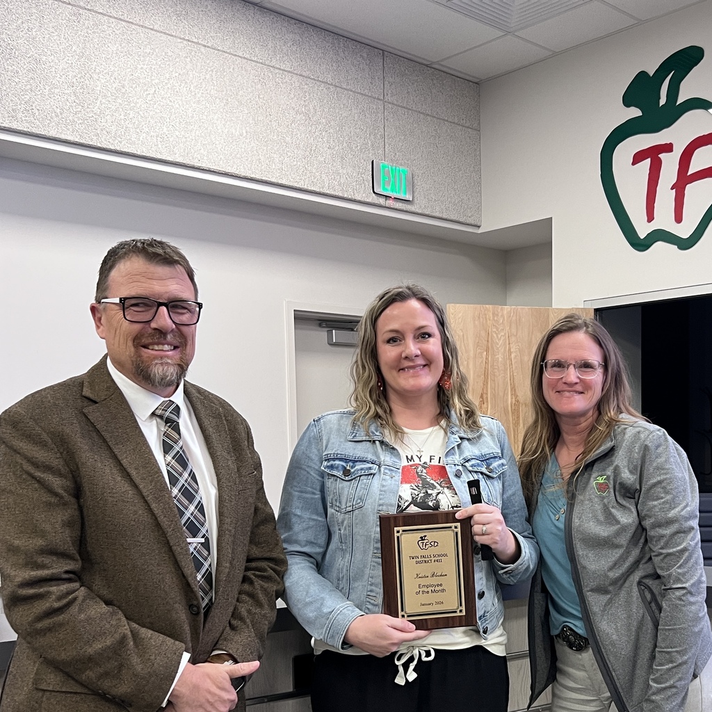 Employee of the Month pictured with superintendent and board member