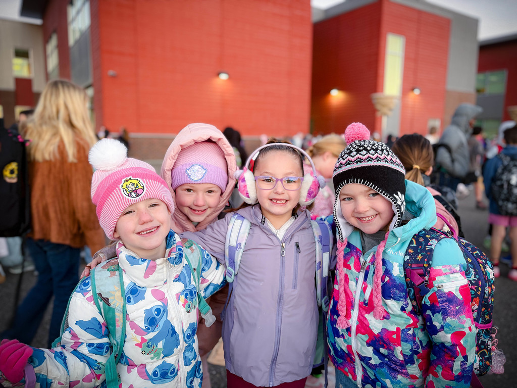 kids in winter clothing on the playground