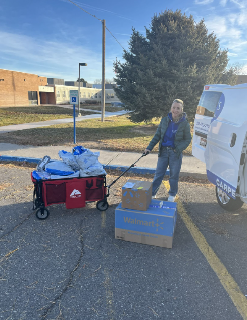 Woman with wagon overflowing with packages